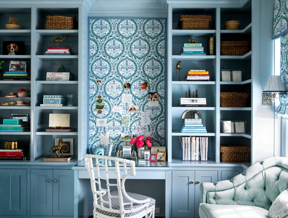 Home office featuring a decorated bookshelf and desk area
