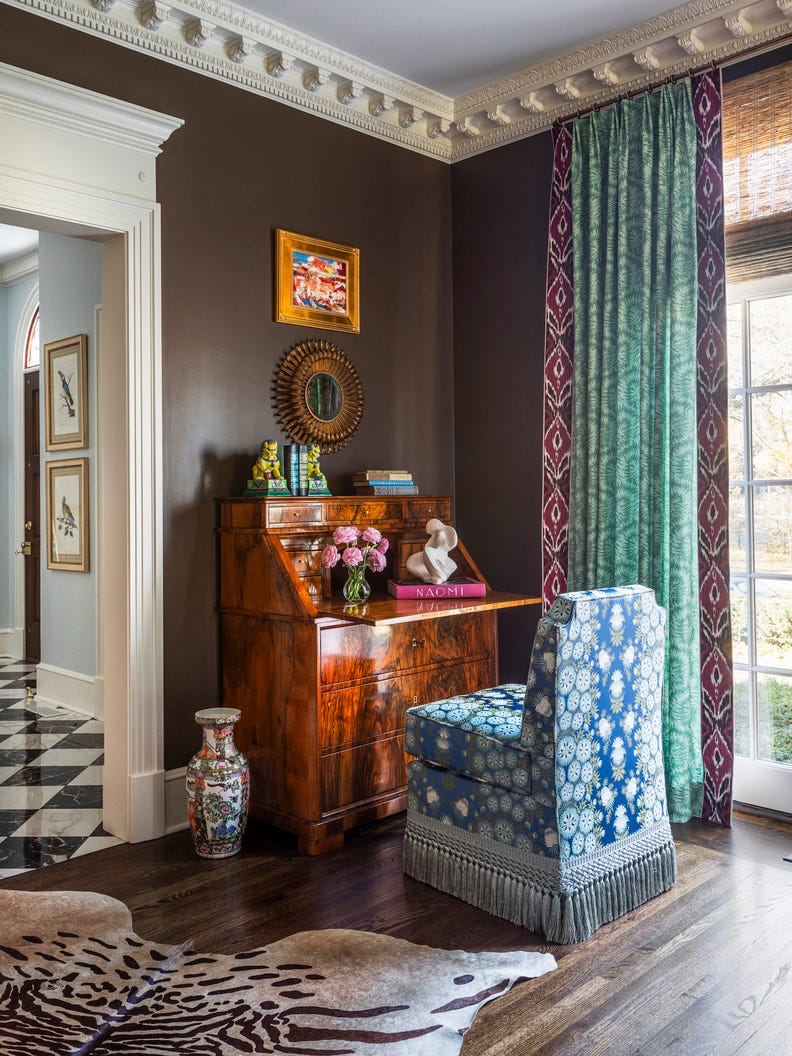 an elegant study area with vintage furnishings and decorative elements