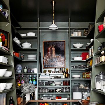 a kitchen with shelves full of dishes