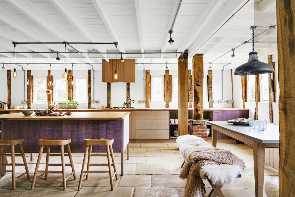 purple and exposed wood kitchen with hidden under-counter refrigerators