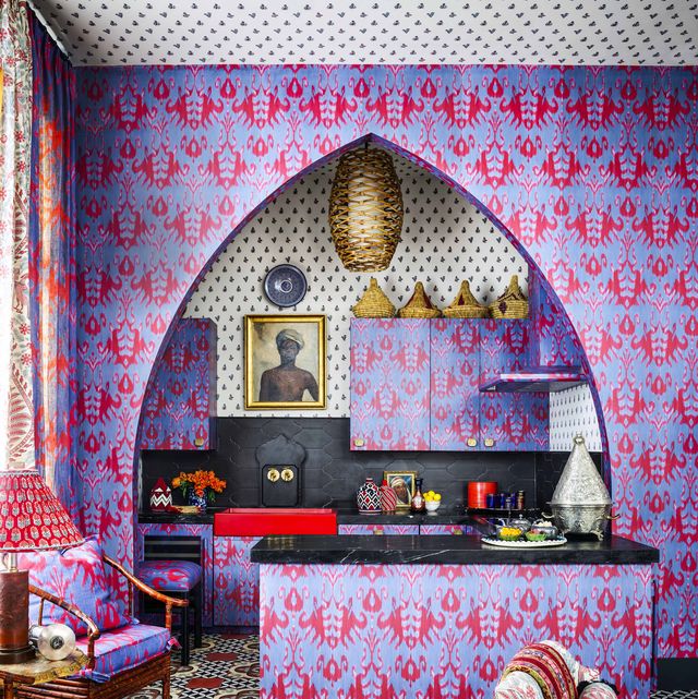 arched kichen with patterned wallpaper