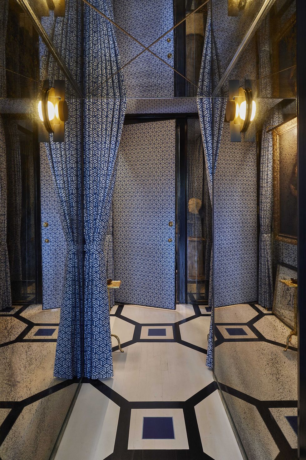 foyer, blue curtains, mirrors, black and blue tiles