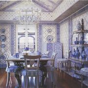 dining room, blue and white wall covering, vases, dining table set up with blue and white fine china and cutlery