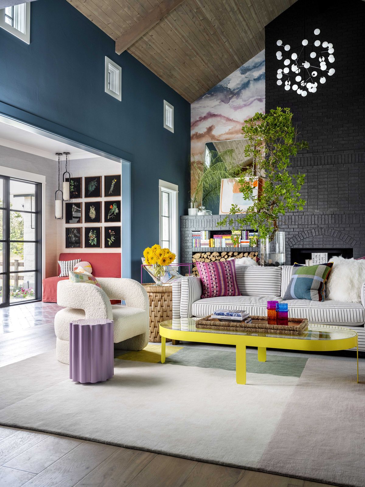 this artful entry by studiomunroe sets the stage fora vibrant living room