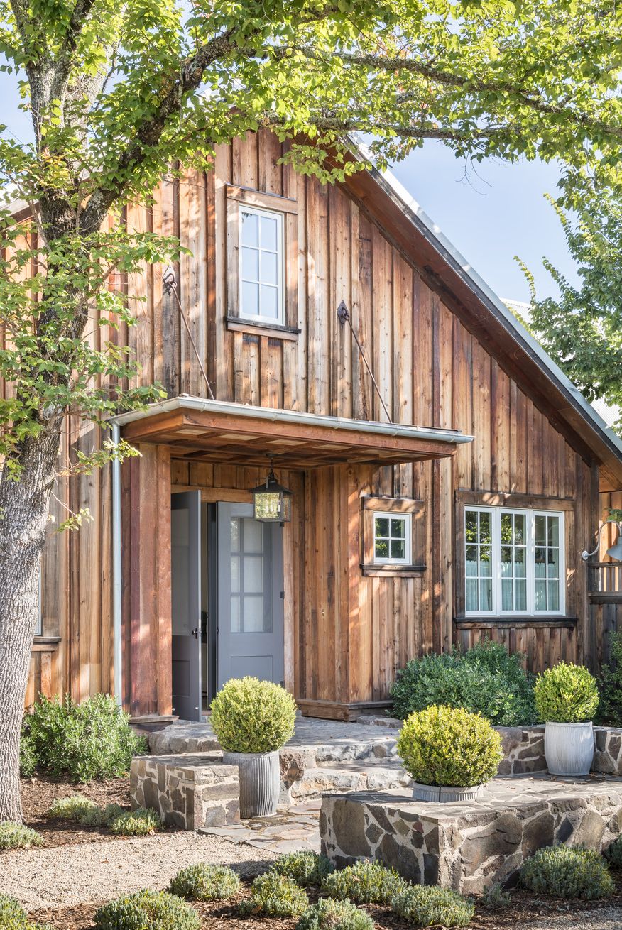 exterior of barn in sonoma, california with weathered cedar siding intact designed by victoria hagan planters chateau sonoma