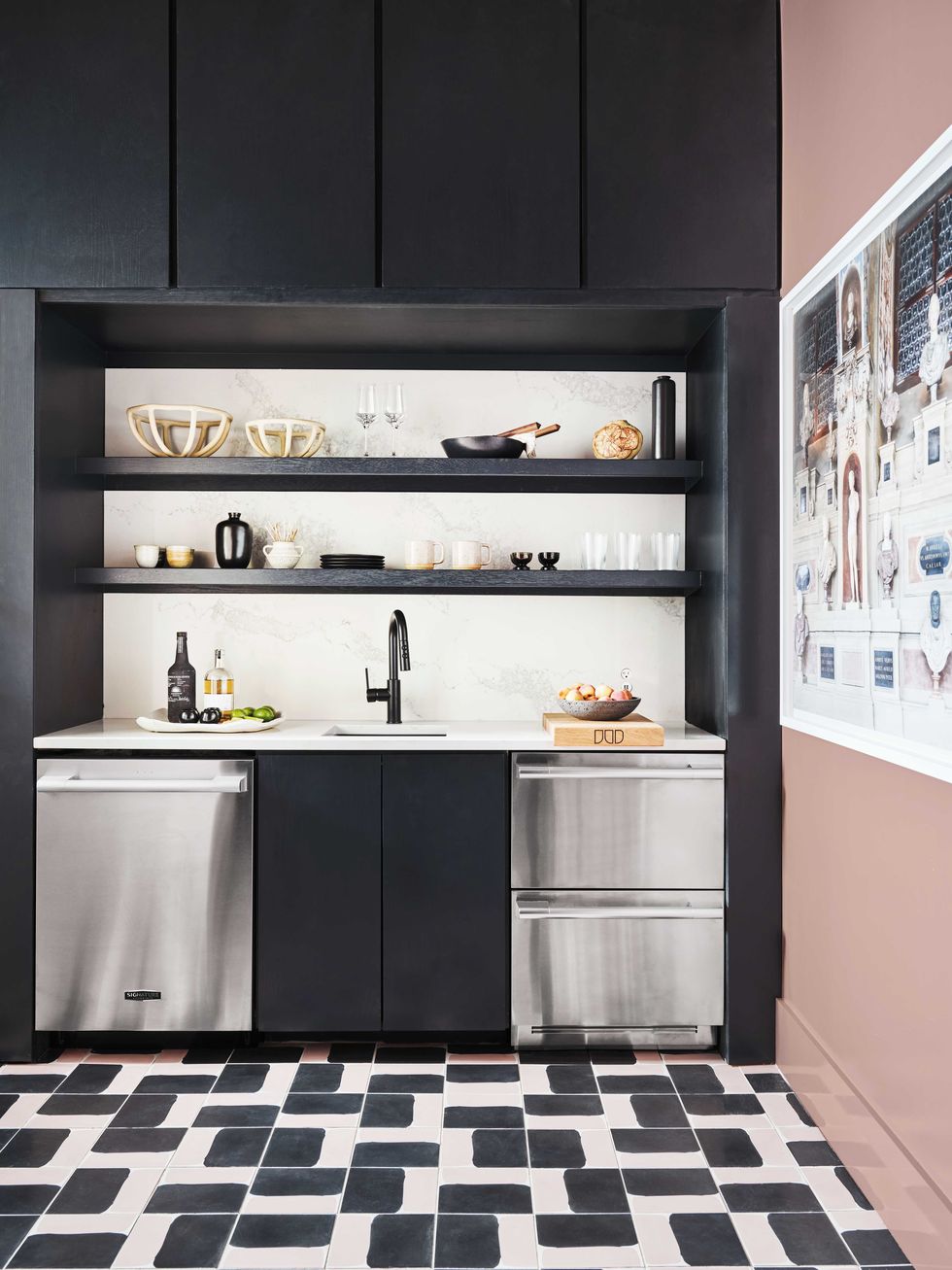 wet bar, pink walls, stainless steel appliances, black cabinets and black shelving