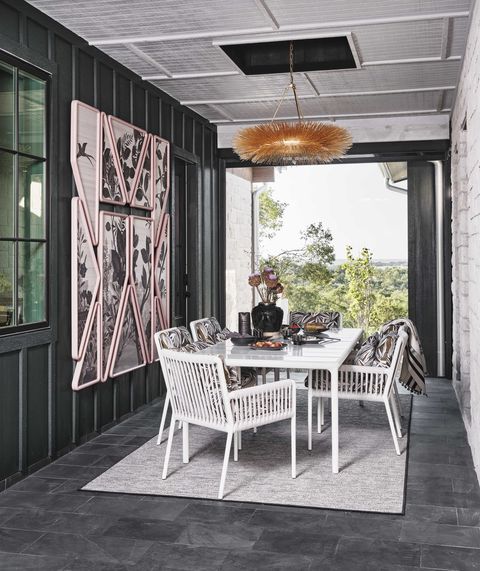 breezeway, white table and chairs, outdoor wall art