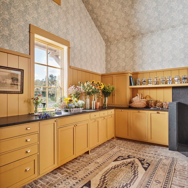 laundry room, yellow cabinets, flowers, wallpaper