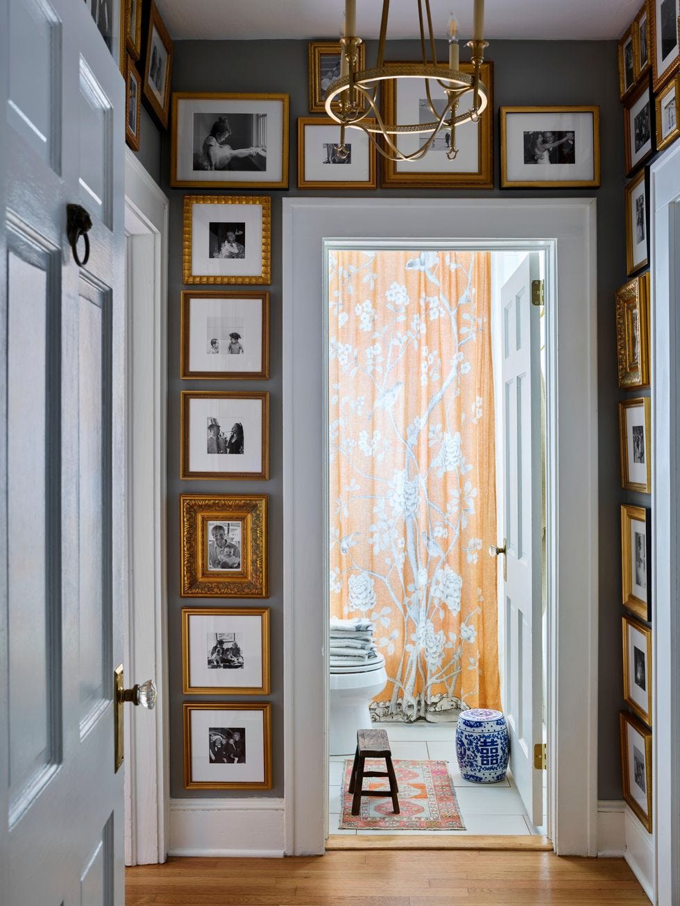 hallway with floor to ceiling gallery wall