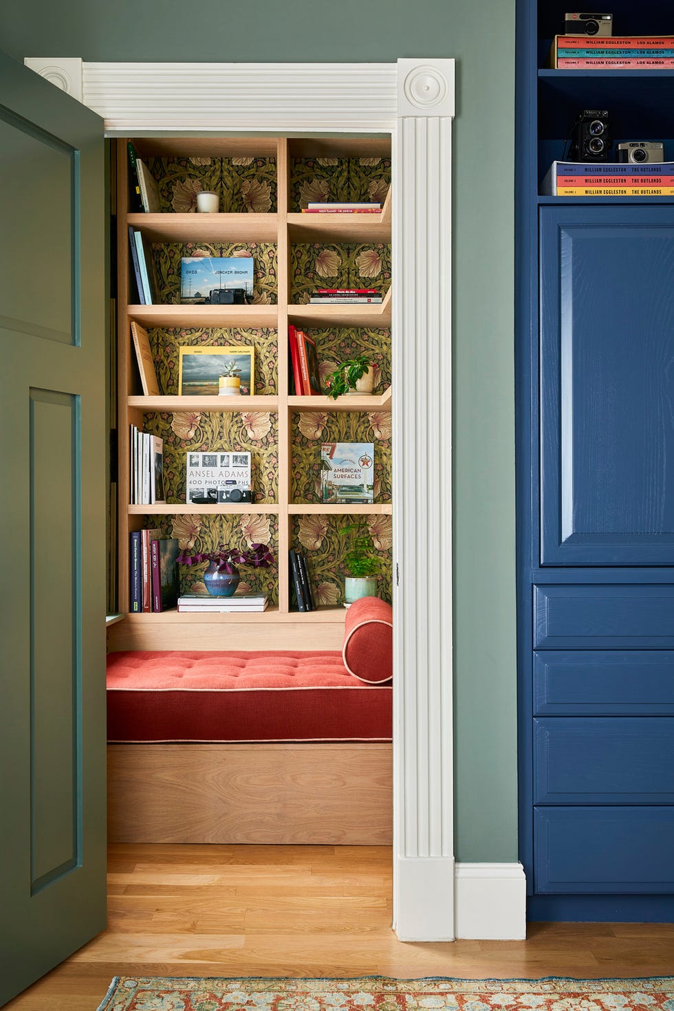 period morris co. wallpaper offsets custom white oak bookshelves. period morris co. wallpaper offsets custom white oak bookshelves.
