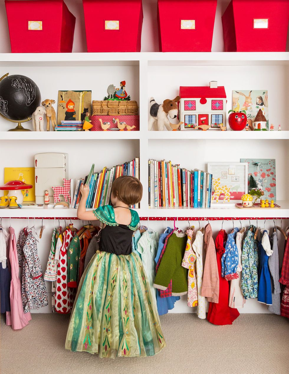 a child in a dress browsing shelves