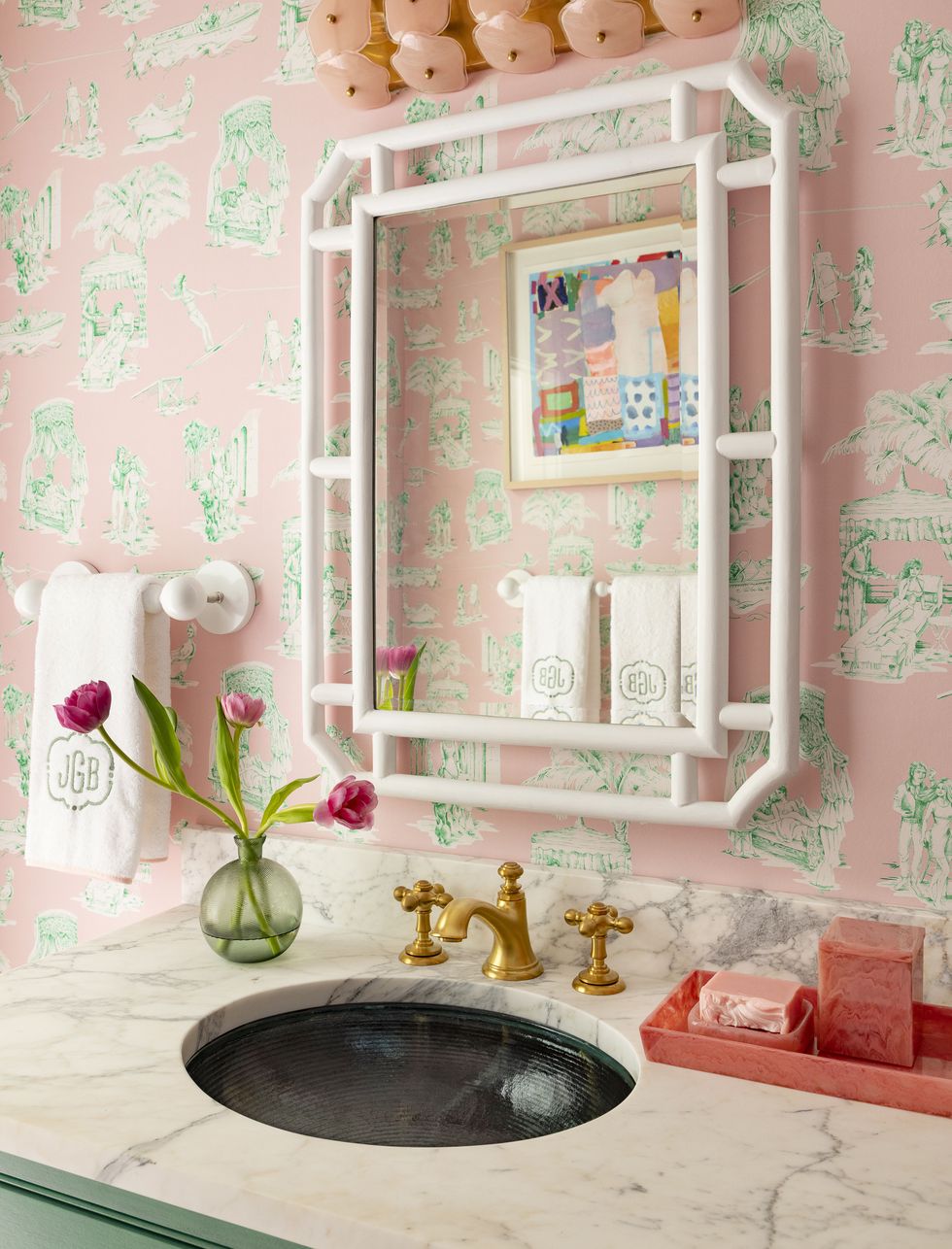 a sink with a mirror and a shelf with flowers