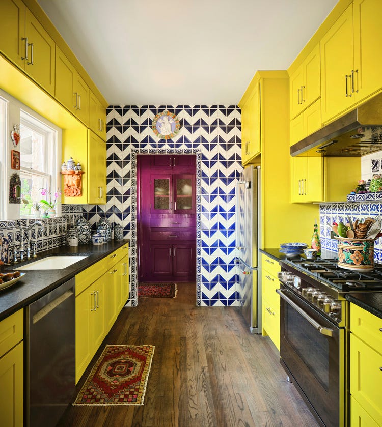 bright yellow kitchen the right shade of yellow turned out to be almost electric wall and backsplash tile tierra y fuego\, reeso tiles paint eye catching\, sherwin williams range bertazzoni joy comes first casita chica, a 1929 cottage in san antonios historic monte vista neighborhood designed by galeana younger for her monther, chica younger decorated fearlessly with fun, bold colors, layered artwork, and unique collections bold hues, rich patterns, and layered textures