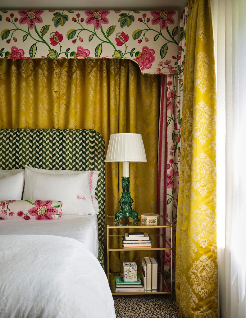 primary bedroom the curtain and canopy provide a pop of color and drama side table west elm bedding matouk, sferra canopy custom, in manuel canovas fabric headboard custom, in schumacher fabric carpet stark yellow drapery, textiles joy comes first casita chica, a 1929 cottage in san antonio historic monte vista neighborhood designed by galeana younger for her monther, chica younger decorated fearlessly with fun, bold colors, layered artwork, and unique collections bold hues, rich patterns, and layered textures