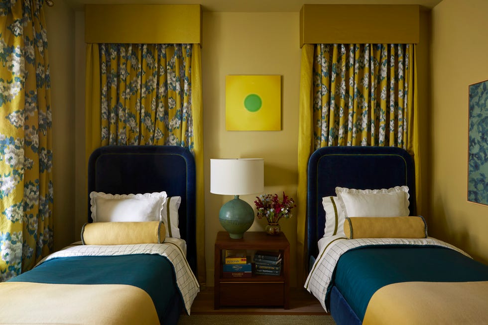 guest roomplayroom byron risdon byronrisdon yellow walls and draperies, blue upholstered beds, child's room, kid's room draperies fabricut lamp visual comfort co art arash fattahi acosta, from minted nightstand serena lily paint churlish green, farrow ball duvet spoonflower mattresses wayfair professional whole home 2024 this year energy efficient home is in the conservation minded community of sprout\, located on a private nature preserve in hendersonville\, north carolina