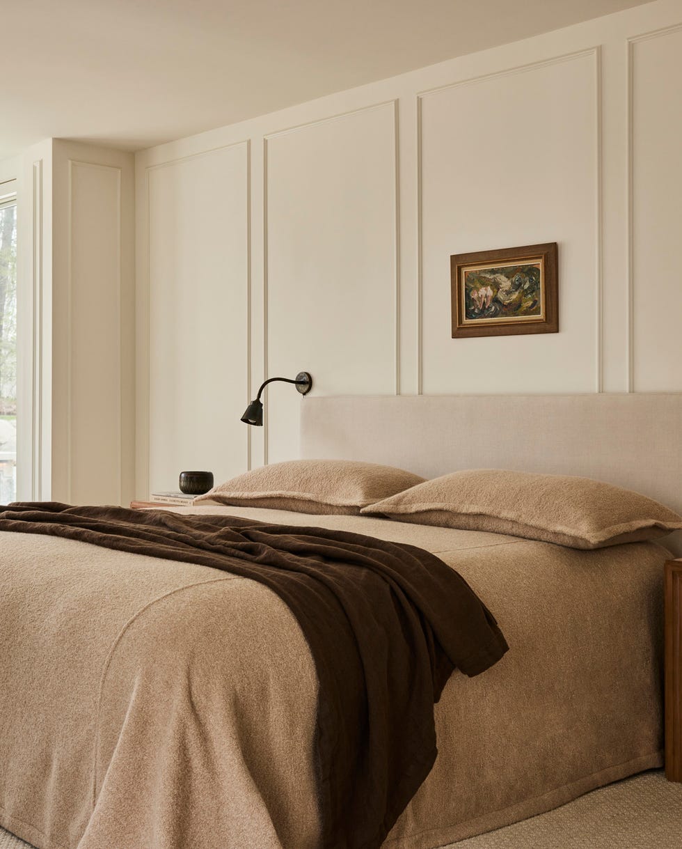 primary bedroom the bouclé bedcover and shams from principal’s daughter encourage endless relaxation. nightstands: crate barrel. sconces: lumfardo. rug: armadillo. side table: häti home. lamp: zara home. quiet time: warm tones and natural textures took this indiana home from cavernous to cozy. warm neutrals, williams creek, indiana, georgian style residence, natural materials, wood accents. primary bedroom the bouclé bedcover and shams from principal’s daughter encourage endless relaxation. nightstands: crate barrel. sconces: lumfardo. rug: armadillo. side table: häti home. lamp: zara home. quiet time: warm tones and natural textures took this indiana home from cavernous to cozy. warm neutrals, williams creek, indiana, georgian style residence, natural materials, wood accents.