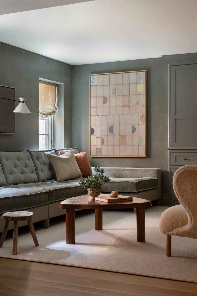 hold the line elegant design\, neutral color palette chicago home designed by wendy labrum with michael abraham architecture inspiration english country estate with a contemporary twist living room, family room, upholstered chair, blue sofa, blue walls, blue cabinet relaxing colors