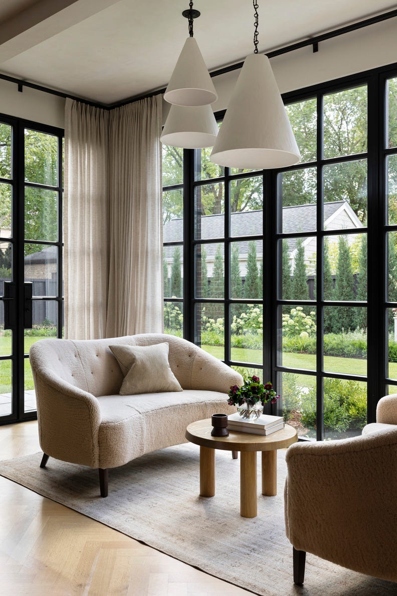 hold the line: elegant design\, neutral color palette. chicago home designed by wendy labrum with michael abraham architecture. inspiration: english country estate with a contemporary twist. sunroom: pendant lamps: rose uniacke. draperies: nobilis. sofas: custom, in edelman leather shearling. large windows, sunny spaces, bright decor. hold the line: elegant design\, neutral color palette. chicago home designed by wendy labrum with michael abraham architecture. inspiration: english country estate with a contemporary twist. sunroom: pendant lamps: rose uniacke. draperies: nobilis. sofas: custom, in edelman leather shearling. large windows, sunny spaces, bright decor.