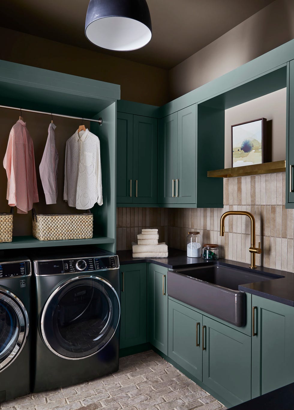 en suite spaces idology interiors design idologyinteriorsdesign the laundry room\, which doubles as the mudroom\, includes a bench specifically sized to tuck boots under it\, as well as a tabletop for folding clothes above a side by side ge profile washer and dryer laundry room located off the garage\, and central to the house\, the mudroom slash laundry room is the drop zone for dirty boots and rain soaked coats appliances ge profile paint monkey puzzle green cabinetry\, mouses back walls\, farrow ball countertops silestone art shina choi\, from minted whole home 2024 this year energy efficient home is in the conservation minded community of sprout\, located on a private nature preserve in hendersonville\, north carolina