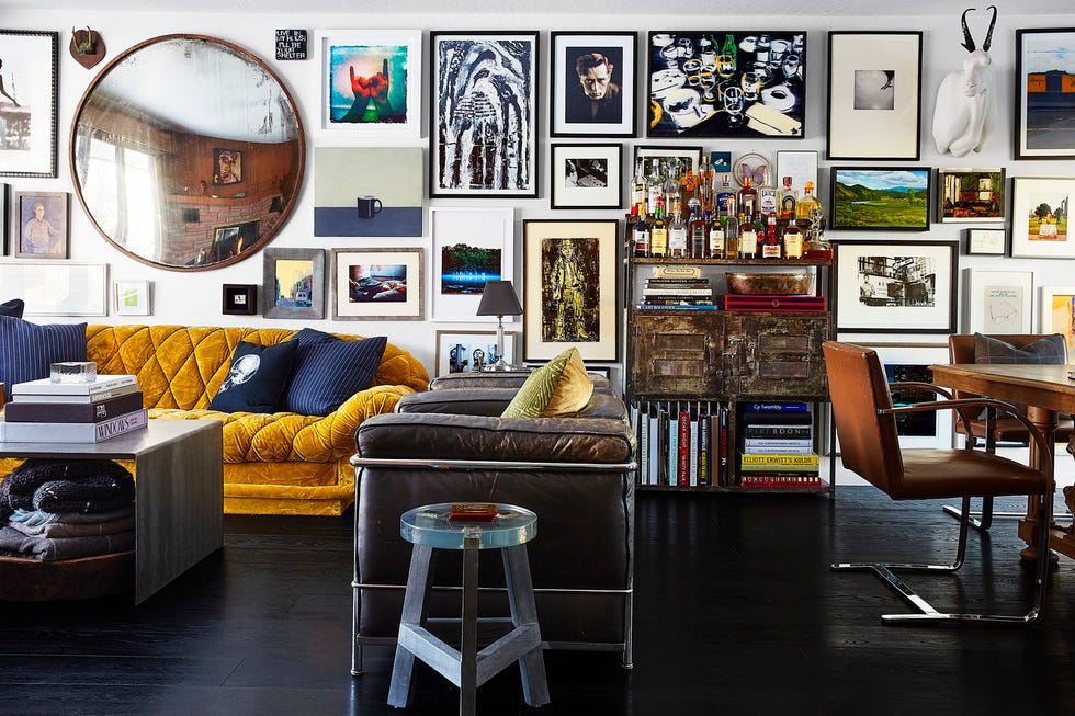 Living room with an eclectic wall gallery and stylish furniture