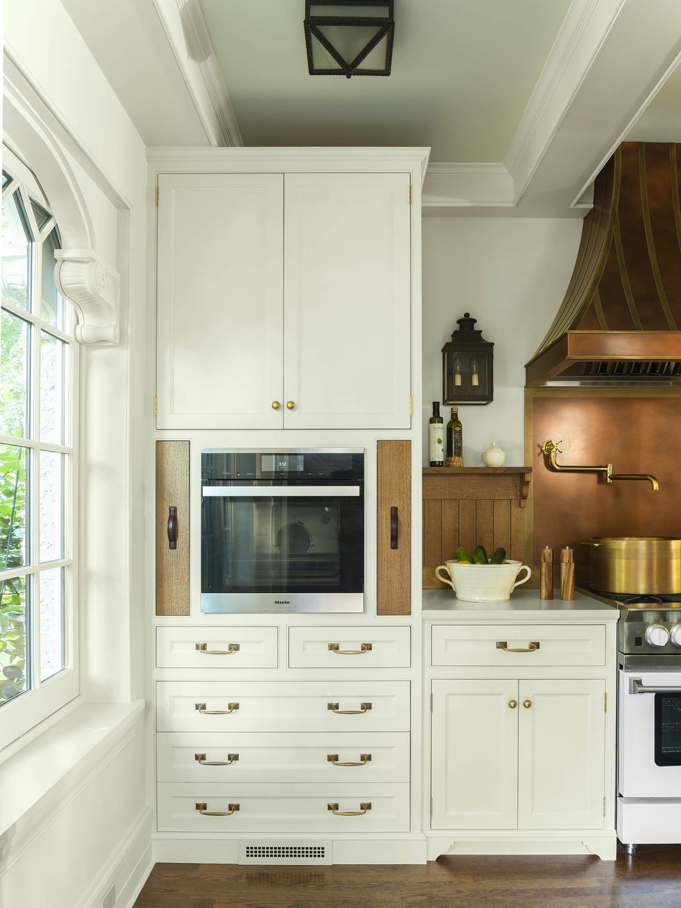 white cabinets, built in oven