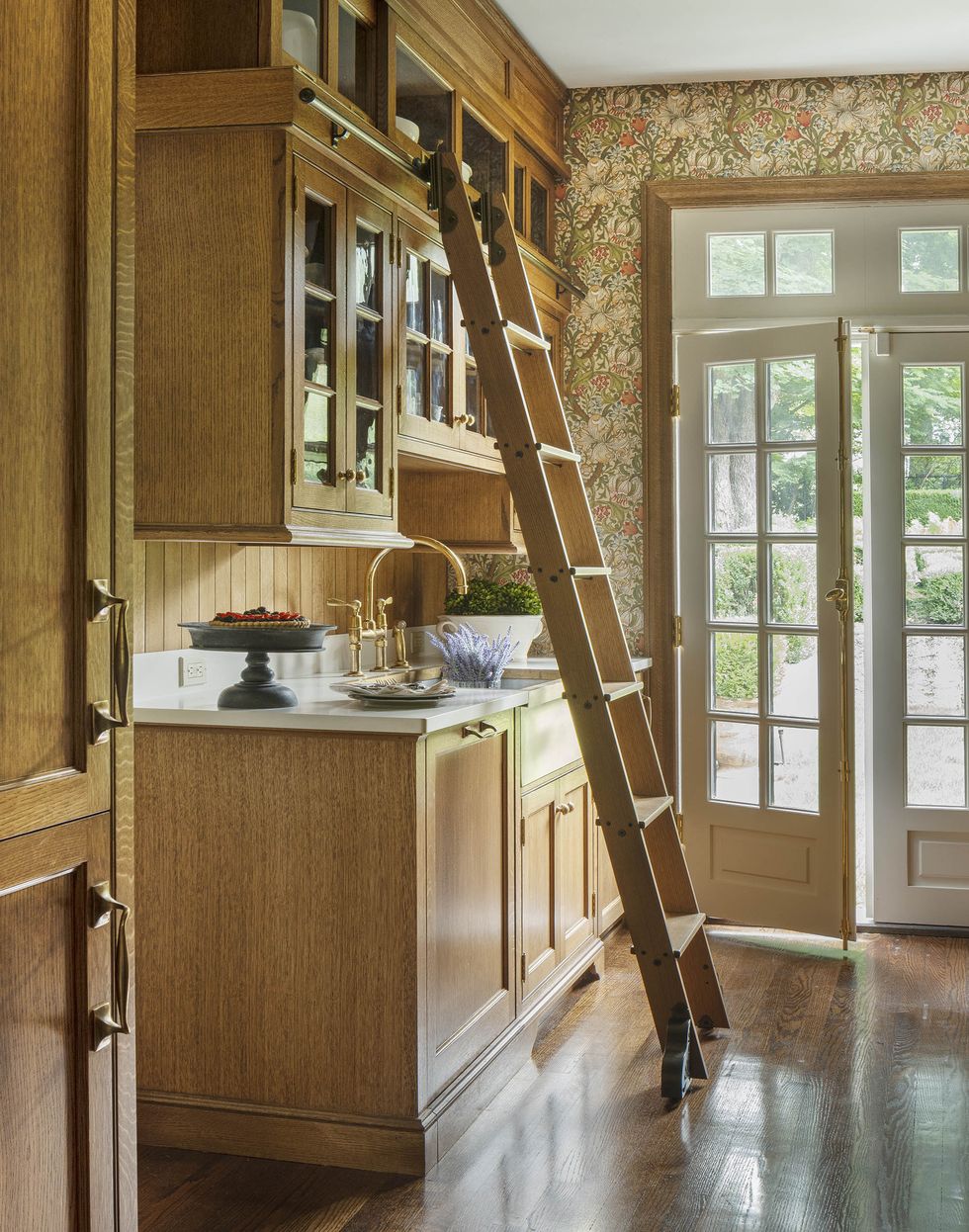 ladder, oak cabinets, sink, french doors