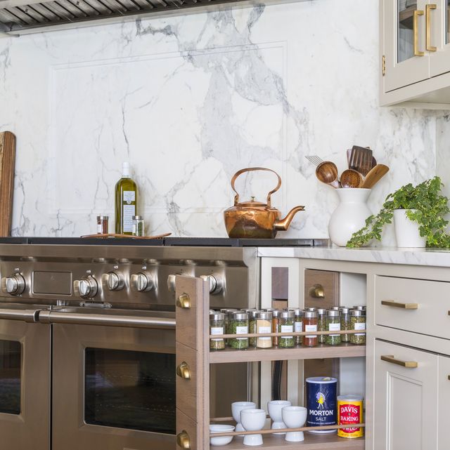 a pullout spice drawer in the kitchen designed by studio dearborn