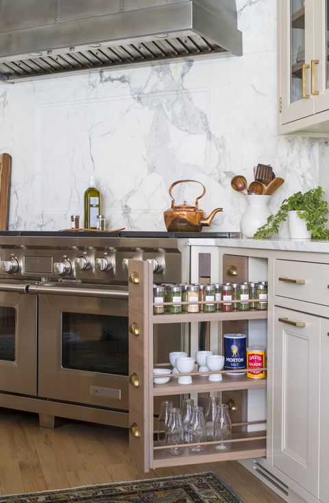 a pullout spice drawer in the kitchen designed by studio dearborn
