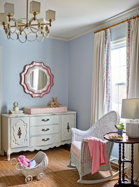 dresser, chandelier, and white wicker rocker