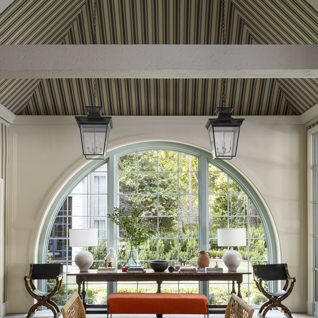 The Large Arch Window In Front Of This Cafe Offers A Glimpse Of The  Creative Interior