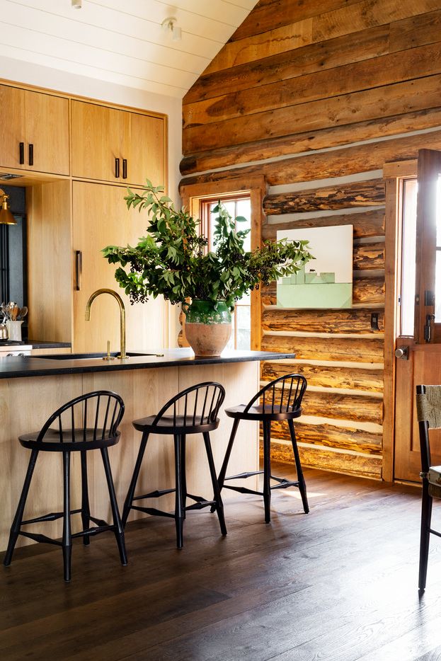Emily Janak Teton Mountains, Jackson Hole, Wyoming Soapstone in the home kitchen is a living finish, says Janak, and it's okay to chip and stain, perfect for cabin stools OG Studio Faucet Callista Valley Lighting Art Craig Spanky Pulls Mark D Sykes Rocky Mountain Hardware Candelabra for Hudson