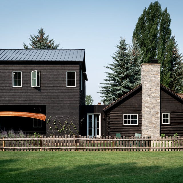 emily janak teton mountains, jackson hole, wyoming home exterior hanging under the extension is a canoe that adam built by hand when he and emily were dating “it is one of my most cherished possessions,” she says