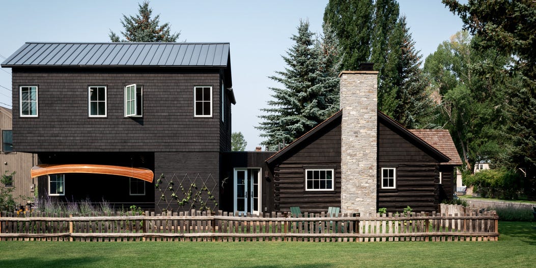 emily janak teton mountains, jackson hole, wyoming home exterior hanging under the extension is a canoe that adam built by hand when he and emily were dating “it is one of my most cherished possessions,” she says