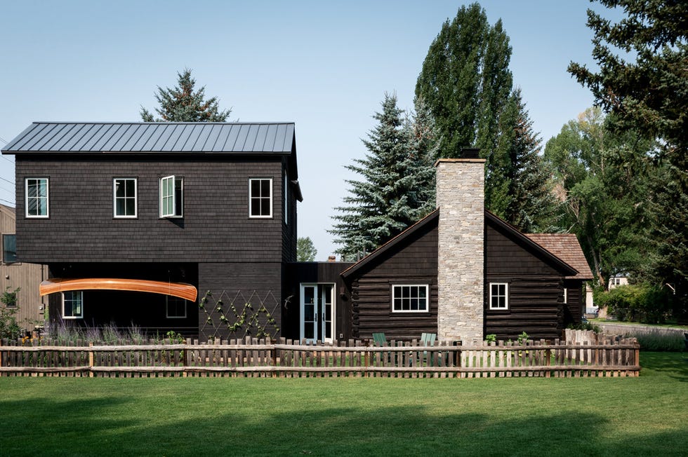 emily janak teton mountains, jackson hole, wyoming home exterior hanging under the extension is a canoe that adam built by hand when he and emily were dating “it is one of my most cherished possessions,” she says