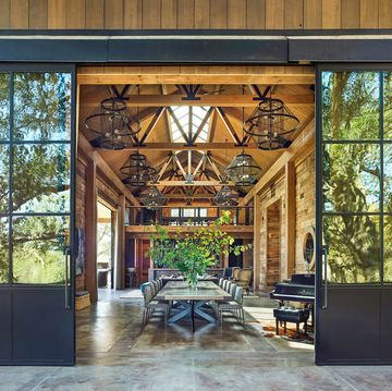 sliding doors open to show spaces barn with table in the center