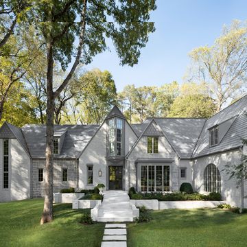 exterior the facade was updated with architectural windows from pella and paint in mole breath and purbeck stone by farrow ball a new pivoting steel door with a schlage smart lock grants guests access from afar 5th annual whole home