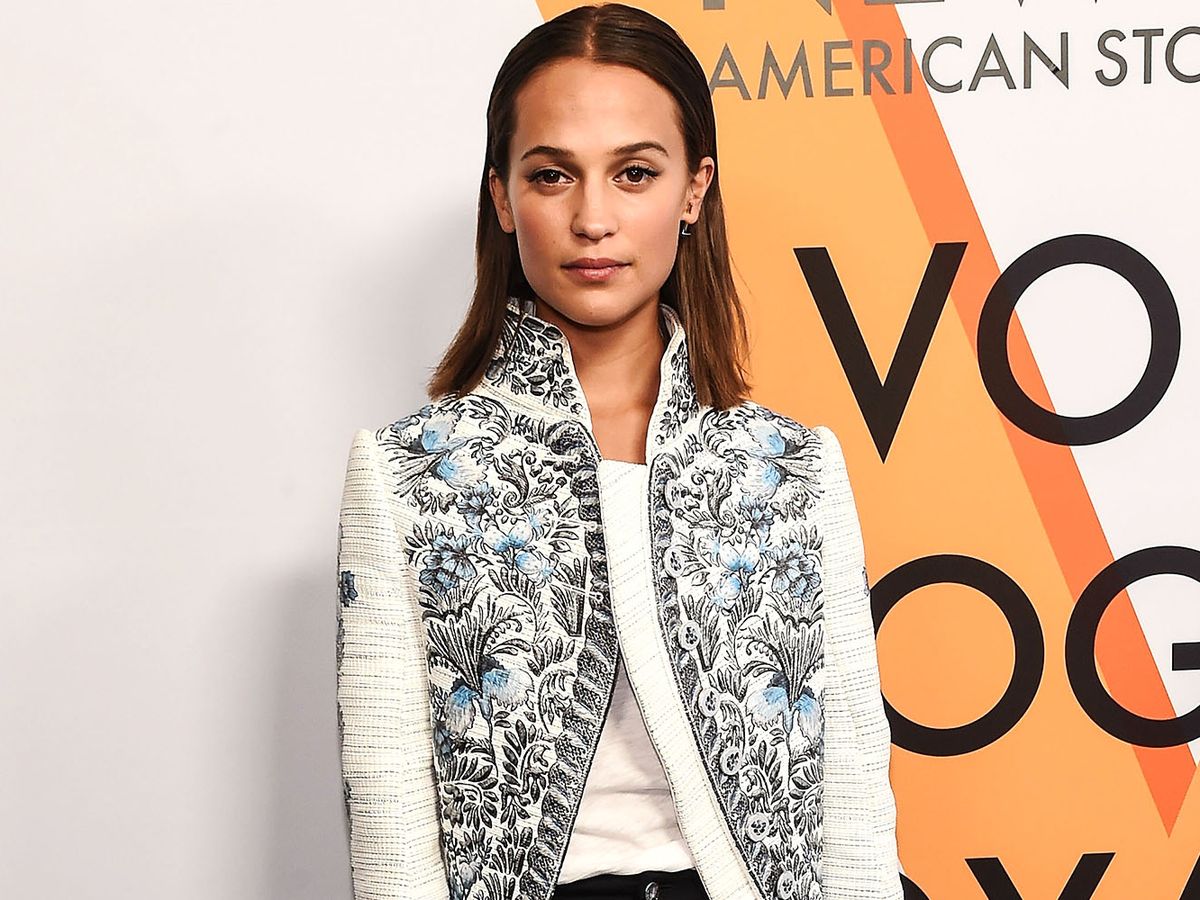 Alicia Vikander flashes her wedding ring as she jets into New York
