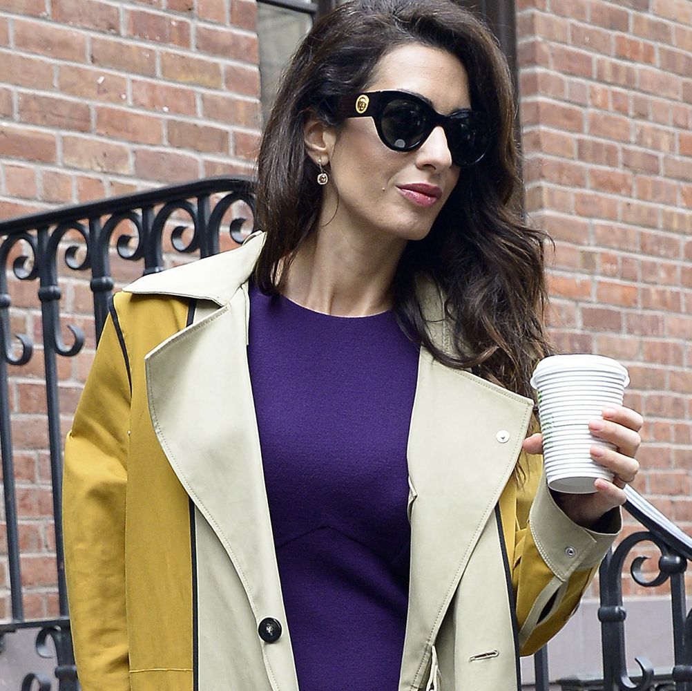 Amal Clooney Wears A Purple Dress And Mustard Coat In New York City