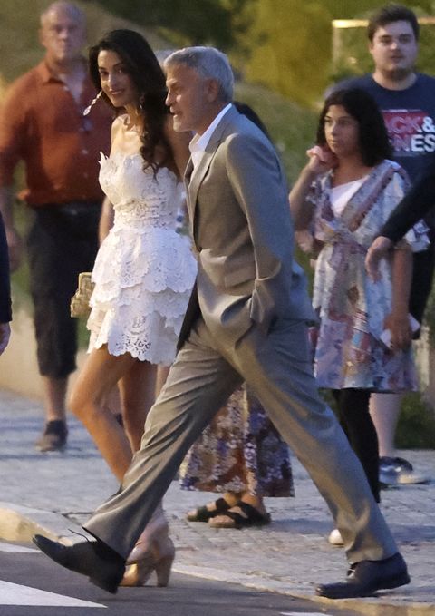 exclusive the clooneys looked very in love and close in a lake view restaurant terrace in lake como they arrived by boat from villa oleandra and spent most of the time having fun and smiling amal, gorgeous as usual in a white mini dress 22 jul 2022 pictured george clooney, amal clooney photo credit mega themegaagencycom 1 888 505 6342 mega agency tagid mega880519020jpg photo via mega agency