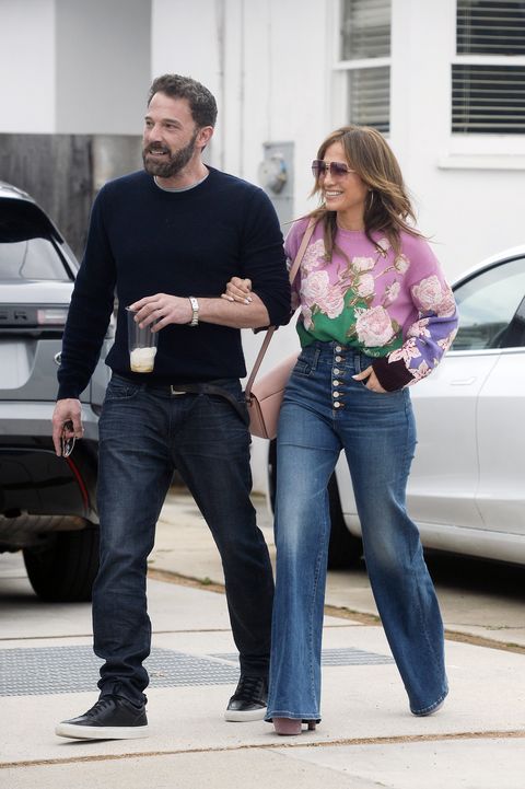 03282022 exclusive ben affleck and jennifer lopez walk arm in arm in los angeles the 52 year old actress and singer wore a valentino floral sweater, button fly bell bottom jeans, and lavender platform heels salestheimagedirectcom please bylinetheimagedirectcomexclusive please email salestheimagedirectcom for fees before use