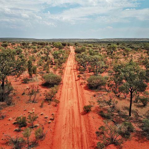 An Aerial shot of the red centre roads in the Australian Outback