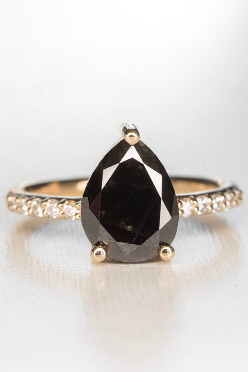 Jewellery, Fashion accessory, Gemstone, Ring, Body jewelry, Engagement ring, Diamond, Onyx, Oval, 