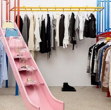 Clothes hanger, Boutique, Room, Closet, Furniture, Wardrobe, Outlet store, Dry cleaning, Building, Interior design, 