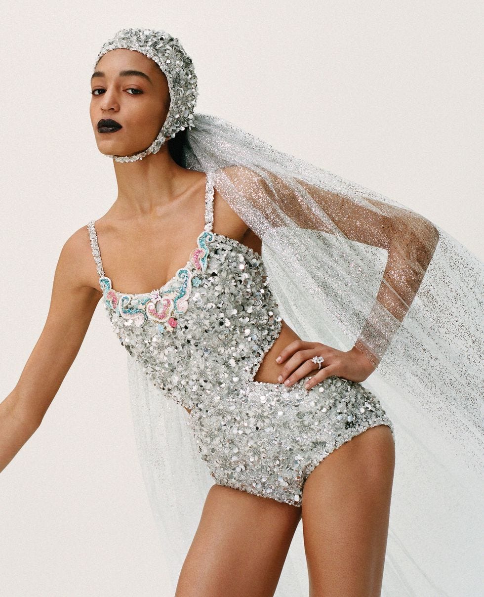 Clothing, White, Fashion model, Beauty, Model, Headpiece, Shoulder, Photo shoot, Silver, Headgear, 