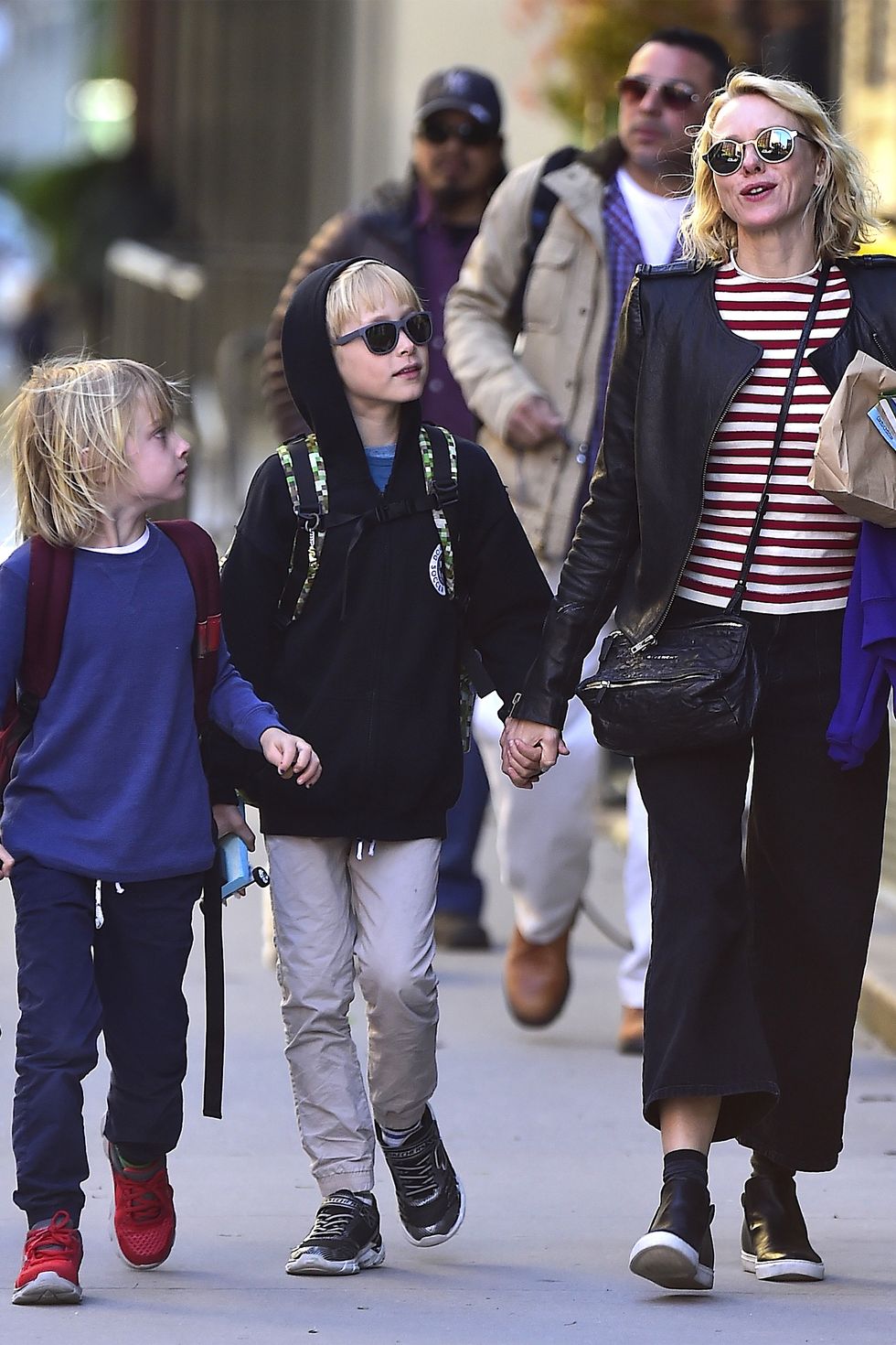 Jennifer Connelly and Paul Bettany hold hands with children Agnes