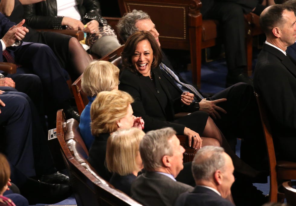 Senators Harris and Warren talk as U.S. President Trump delivers his second State of the Union address to a joint session of the U.S. Congress in Washington