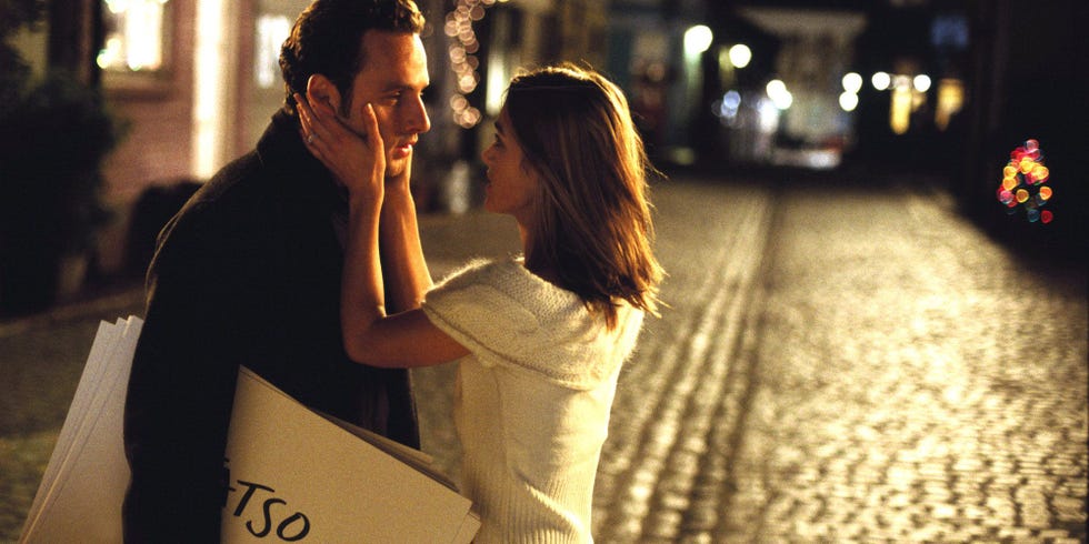 romantic interaction between a couple in a cobblestone street