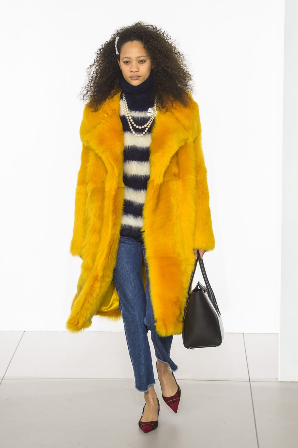 Clothing, Fashion model, Fur, Yellow, Orange, Fashion, Coat, Fur clothing, Outerwear, Overcoat, 