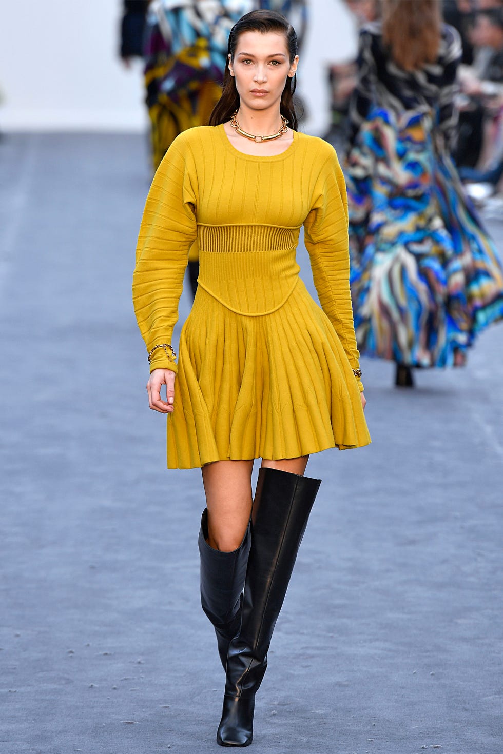 Fashion model, Fashion show, Fashion, Runway, Clothing, Yellow, Shoulder, Footwear, Street fashion, Joint, 