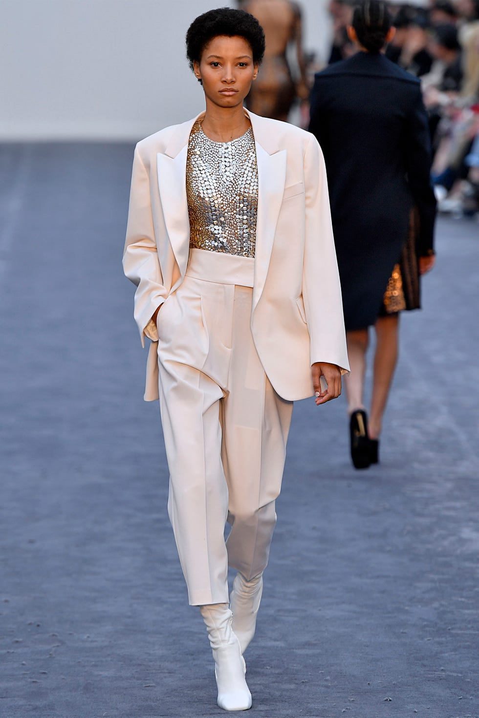 Fashion, Fashion model, Fashion show, Runway, White, Clothing, Haute couture, Outerwear, Human, Public event, 
